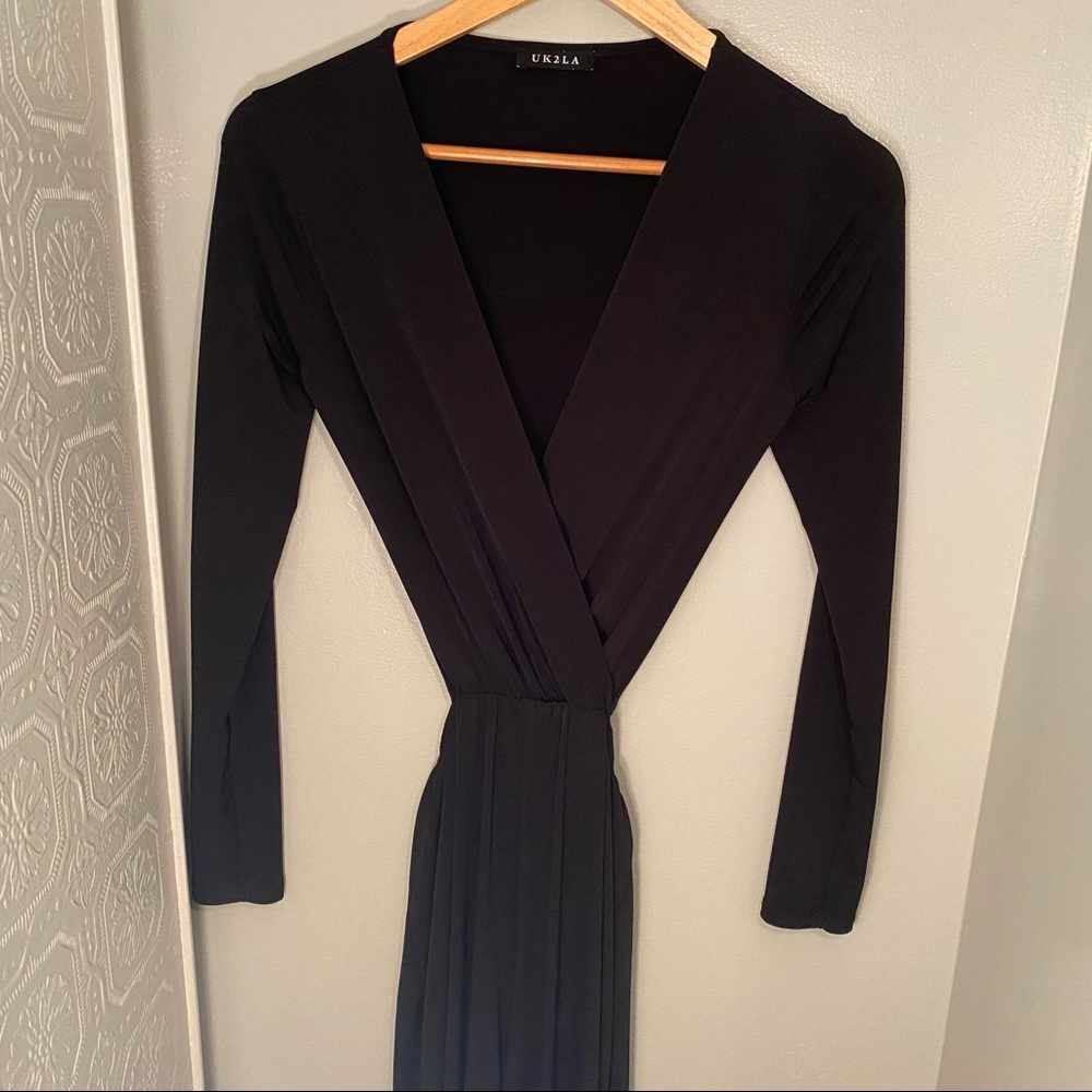 One piece long sleeve black jumpsuit with wide leg bottoms